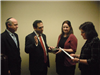 Council member swearing in with others members